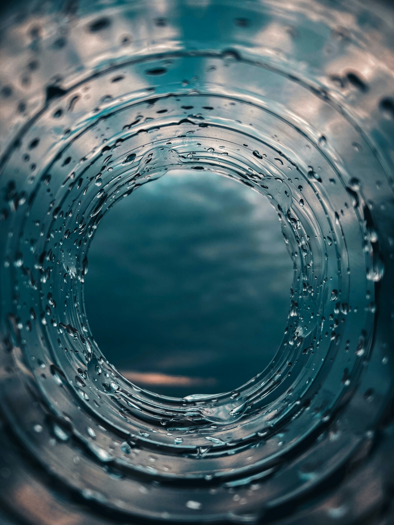 Abstract water droplets forming a soft circular opening